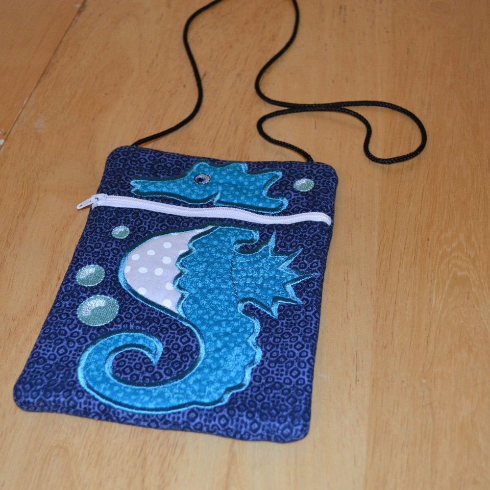SOLD.      NWOT handmade enbroidered purse